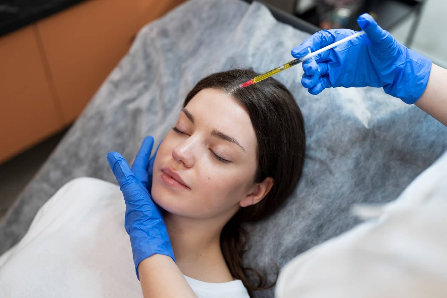 A patient undergoing the Injectable Autologous Regenerative Fibrin procedure, exemplifying a safe and minimally invasive anti-aging treatment.